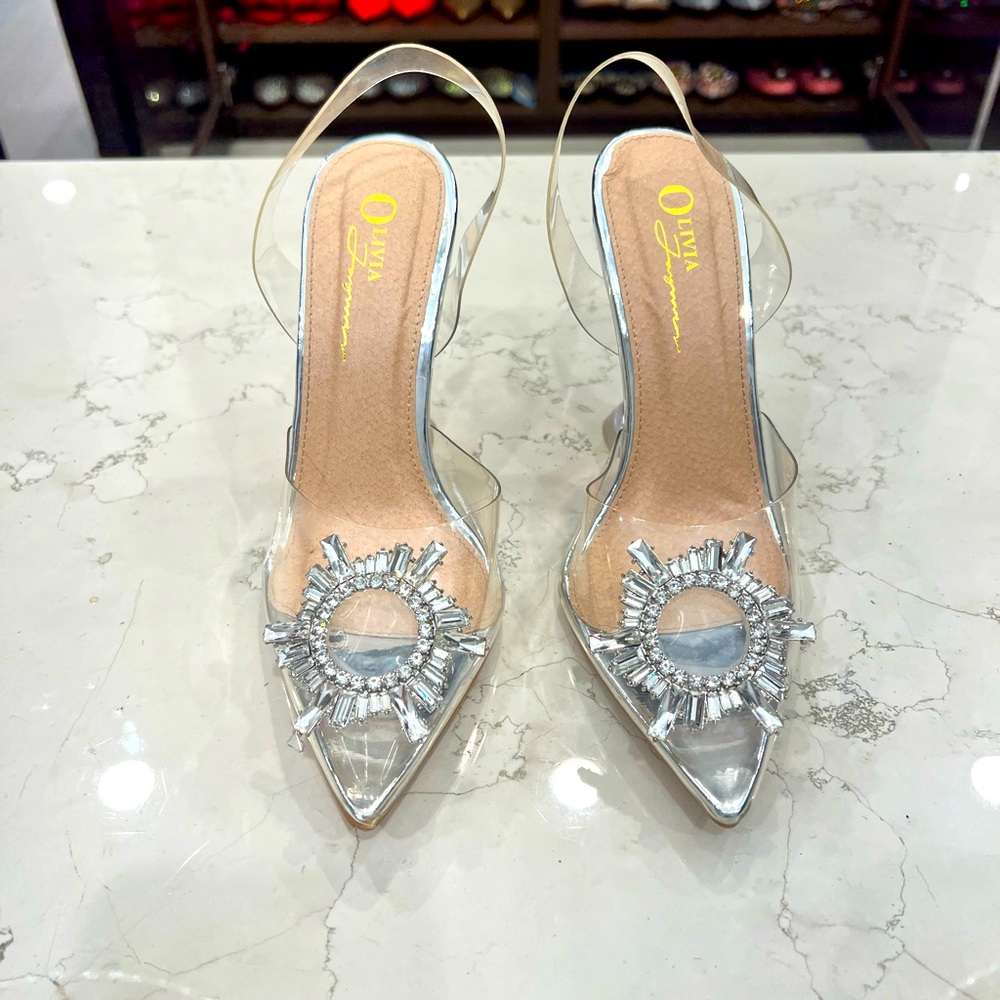 Olivia sea through pointy shoes with silver brooch embellishment. Very sexy